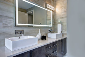 second surface mirror hanging in contemporary bathroom JNS Glass & Coatings Colorado